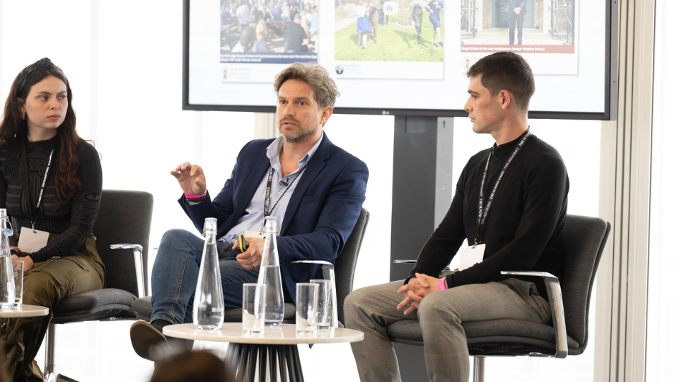 Three journalists at a Newsrewired talk.